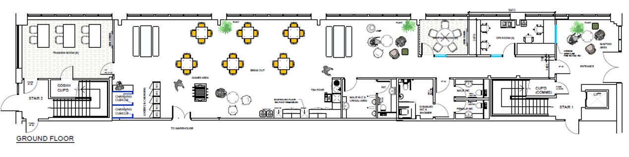 Floor plan section showing an open collaboration area with round tables and chairs, flanked by rows of desks and a corridor leading to a staircase.
