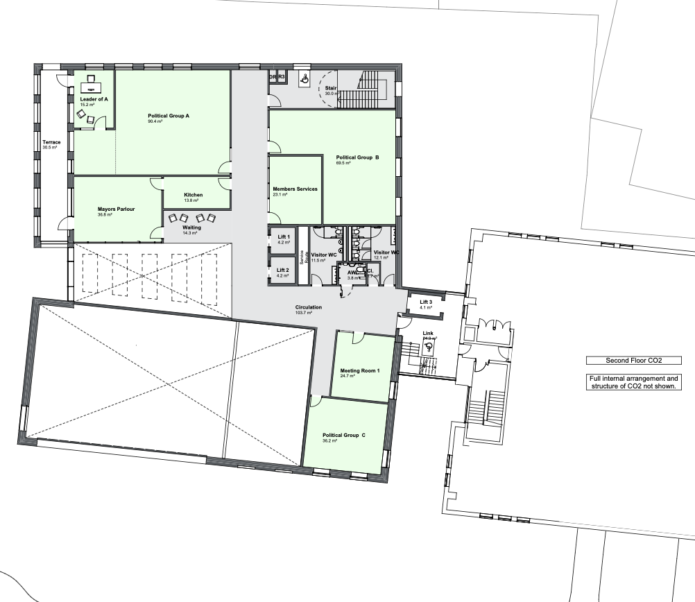 Floor plan showing several green-shaded meeting and enclosed rooms alongside a large open pink-shaded space, with a central corridor and stairwell.